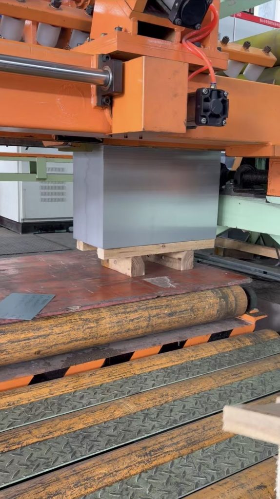 Cut-sheet bundle being lifted at the stacking section
